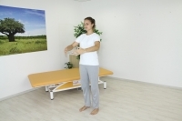 Straightening the spine and intra abdominal pressure in a standing